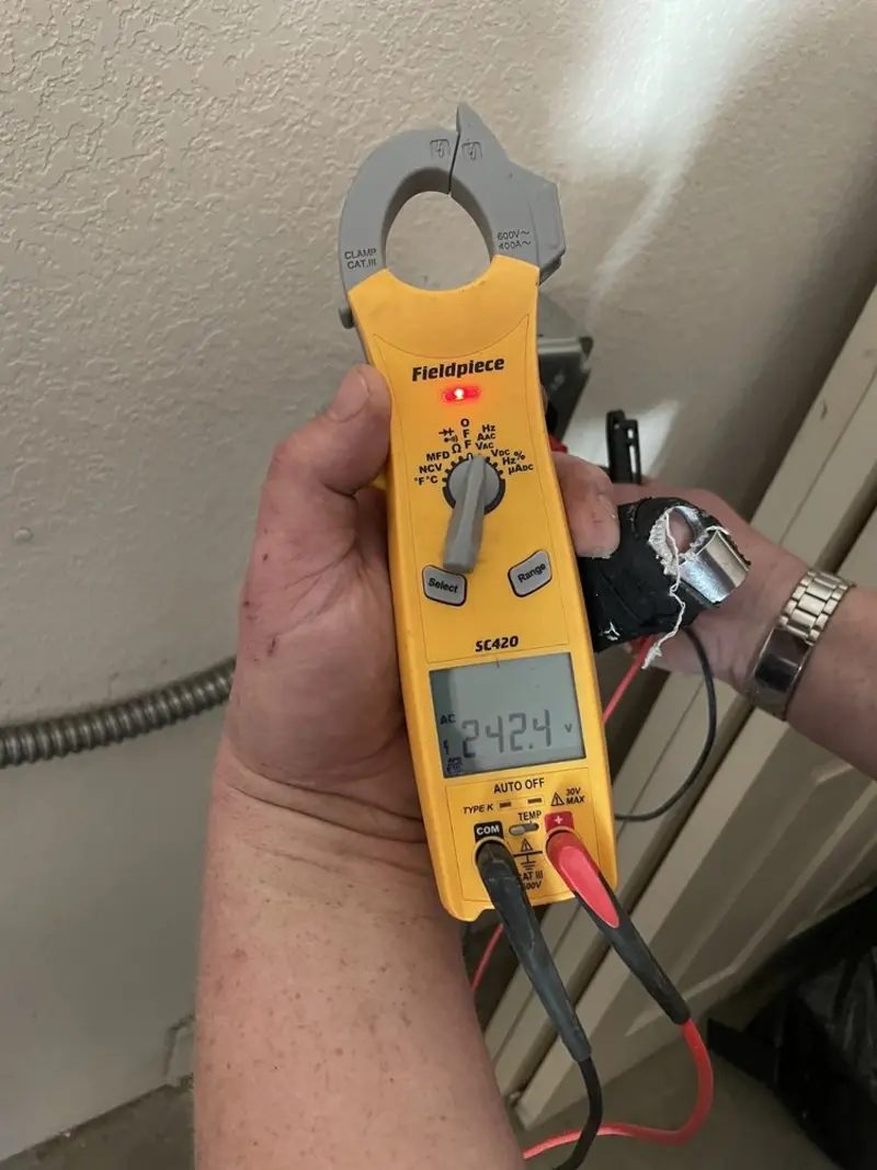 Voltage testing with clamp meter during Circuit Breaker Repair in Loveland